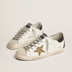 Golden Goose Super-Star sneakers with gold star and glittery black heel tab